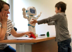 Robot creating a bridge between therapists and autistic children